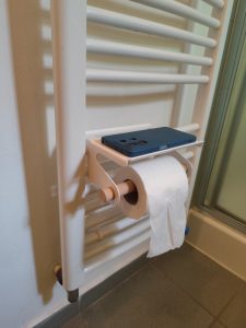 Mobile phone shelf and toilet paper holder - hanging on the radiator